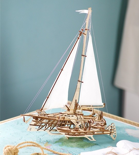 Ugears mechanical model kit Trimaran Merihobus and wooden 3D puzzle. Bench model of multihull sailboat with winches, rigging, bulkheads, frames and beams and hulls, model for self-assembly. Original gift for boys and girls and smart hobby for grown-ups.